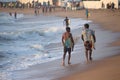 Kovalam, Chennai, Tamilnadu, India - Ã¢â¬Å½Ã¢â¬Å½August 9th Ã¢â¬Å½2021: Two young Indian surfers carrying surfboard and walking on the